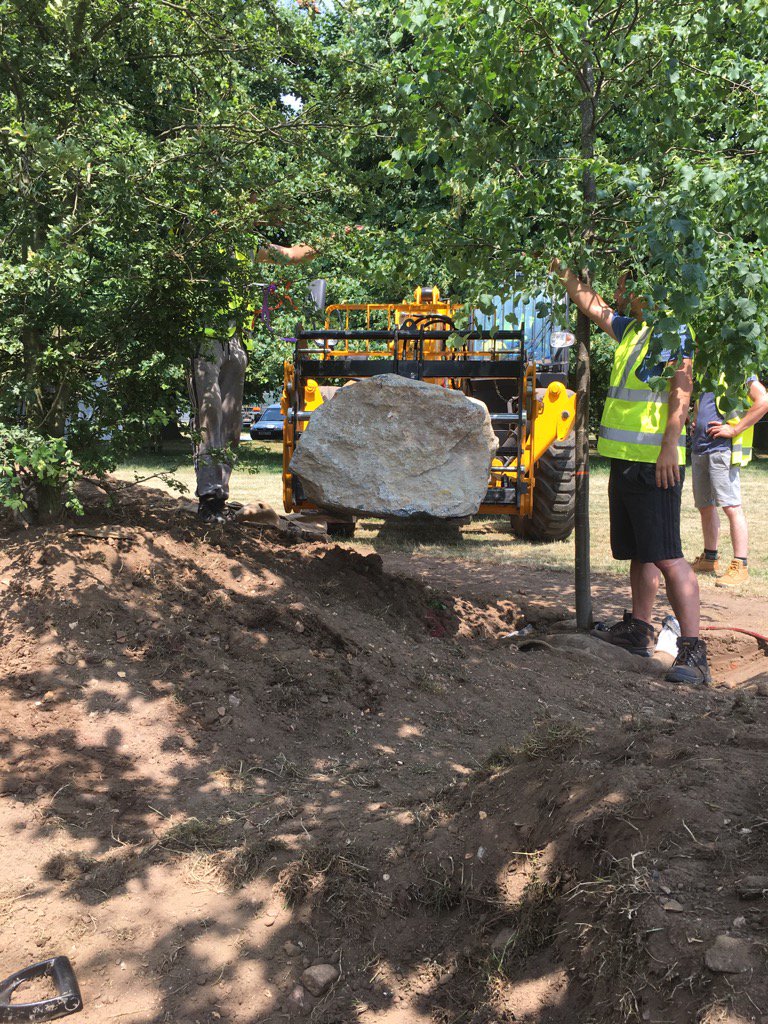 The boulders being moved into place…