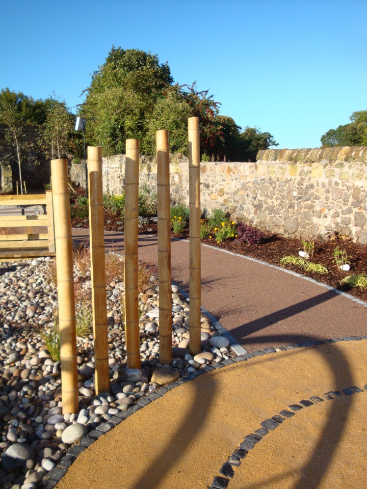 A garden with Gold and Red CECEC Footpath Gravel…