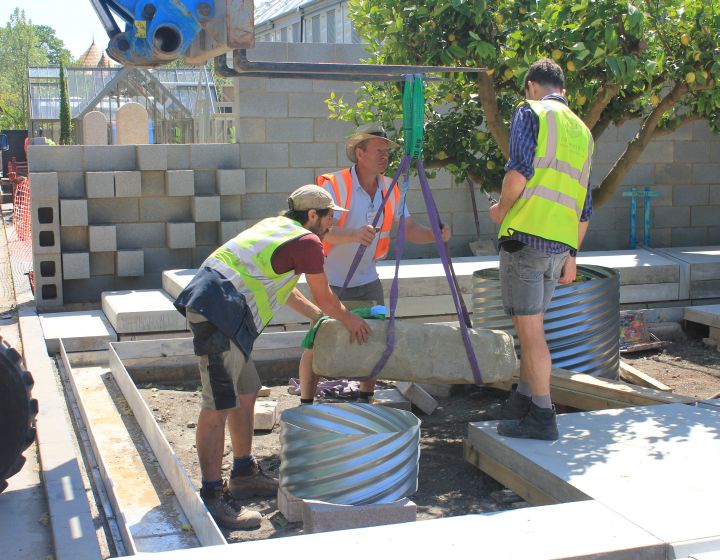 Tom and the team from Landscape Associates placing a Yorkstone rockery…